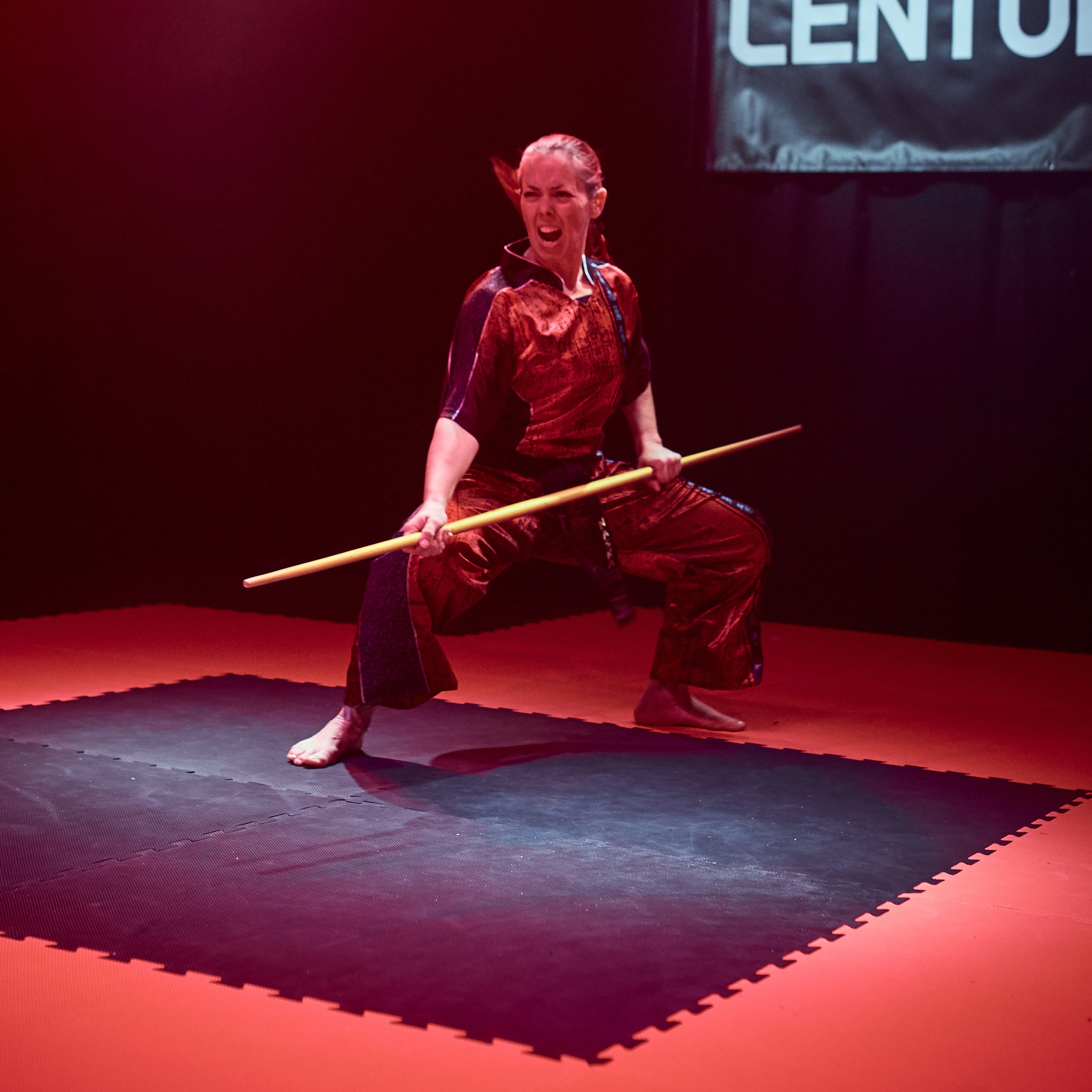 puzzle mat with martial artist posed on mat flooring