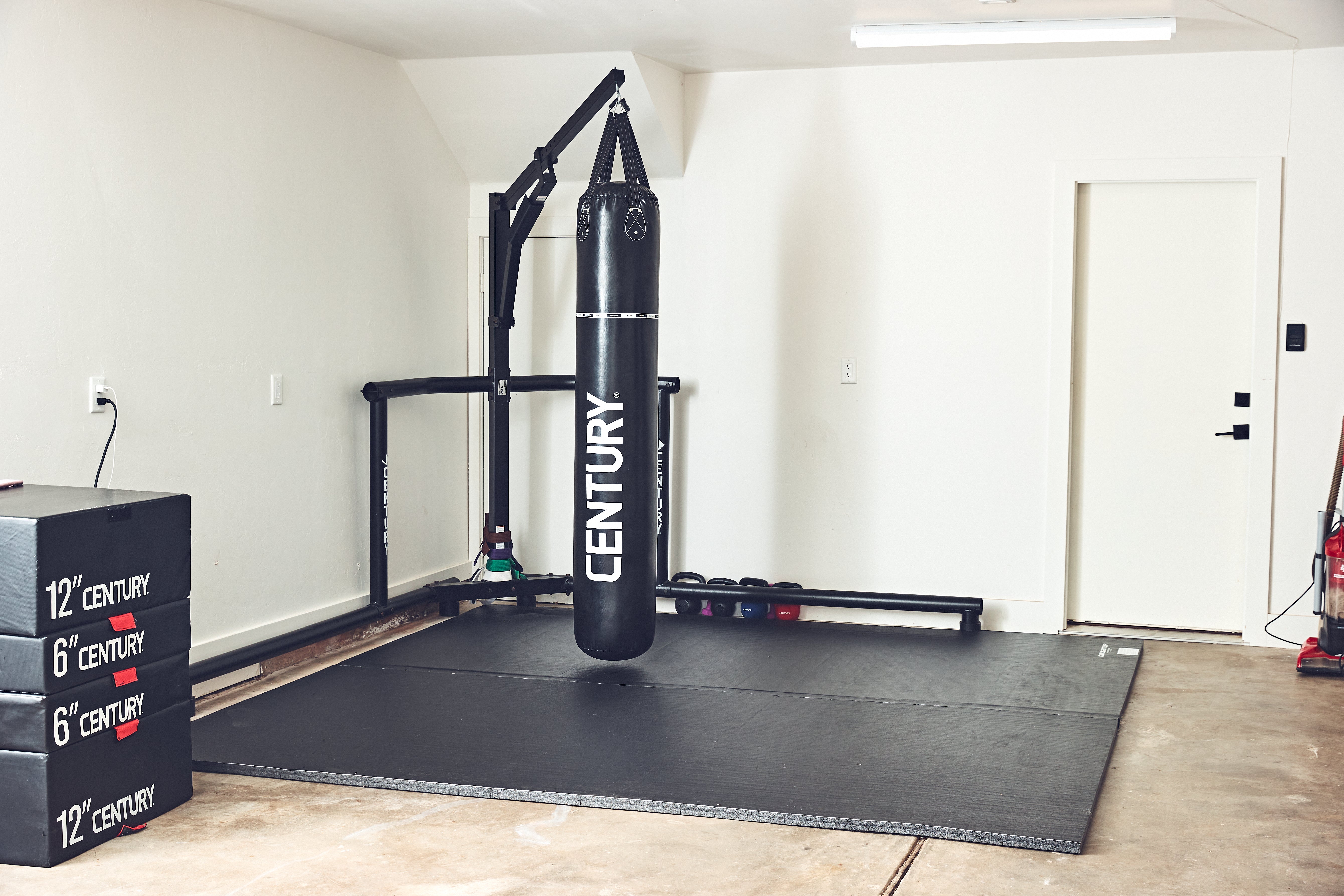 bag stand with muay thai bag on mats