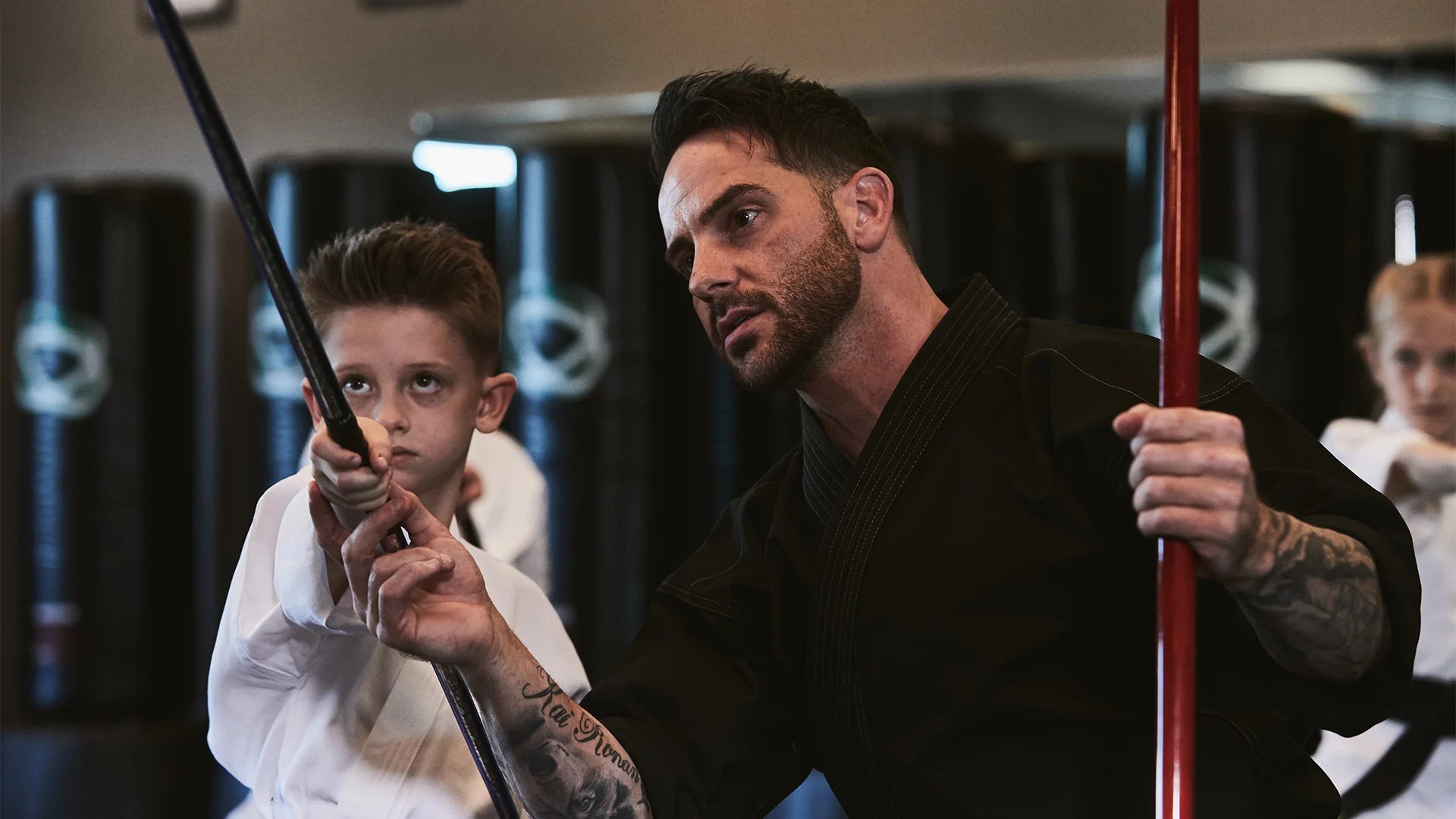 teacher and student with a bo