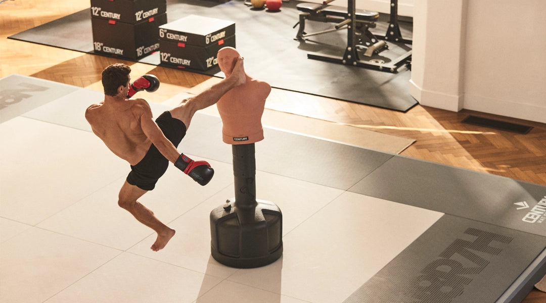 Martial artist kicking Bob on tile mats