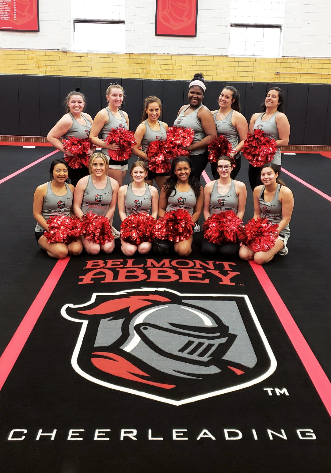 Cheerleaders on custom mat