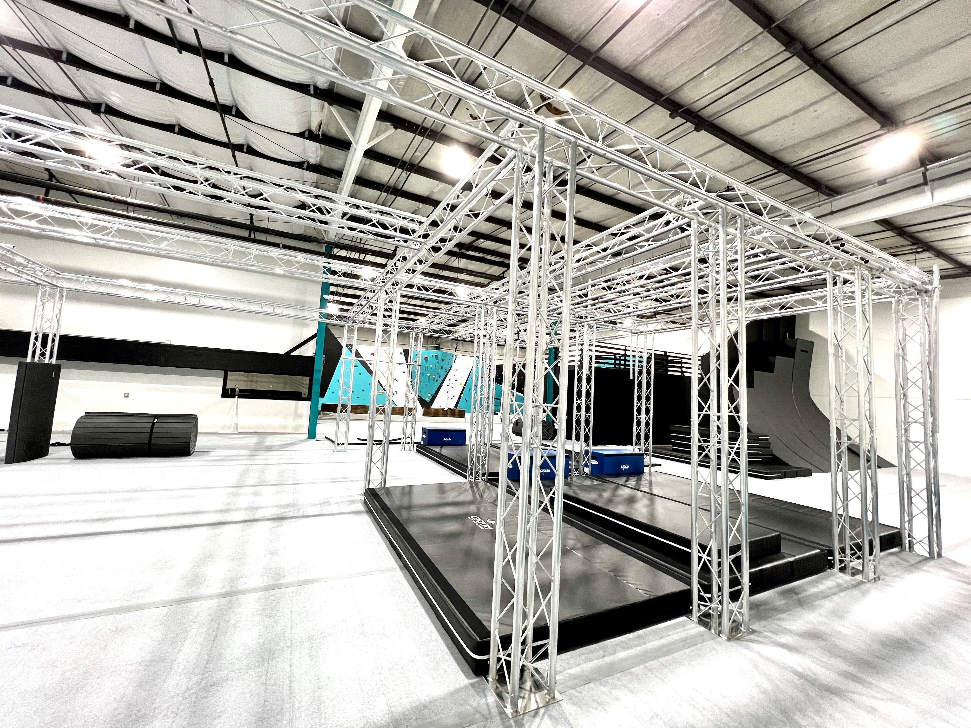 gym with stunt, parkour, obstacle and rock climbing flooring