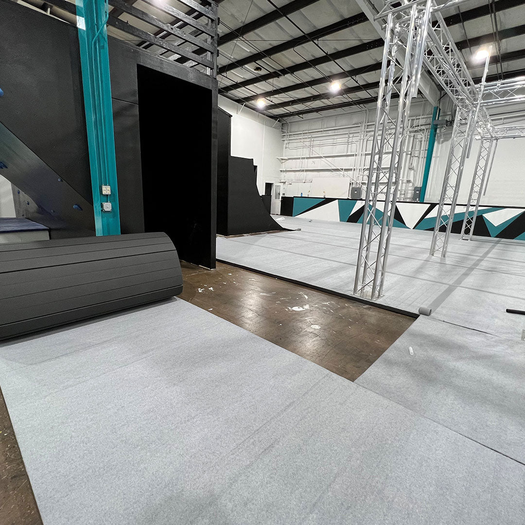 Gym with carpet bonded foam mats