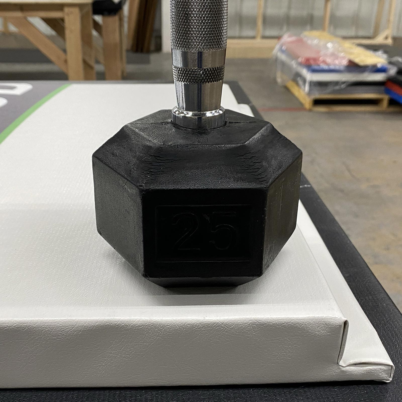 century wall pad with dumbell on it
