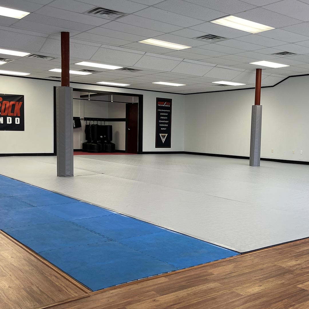 gym with floor, wall & post padding